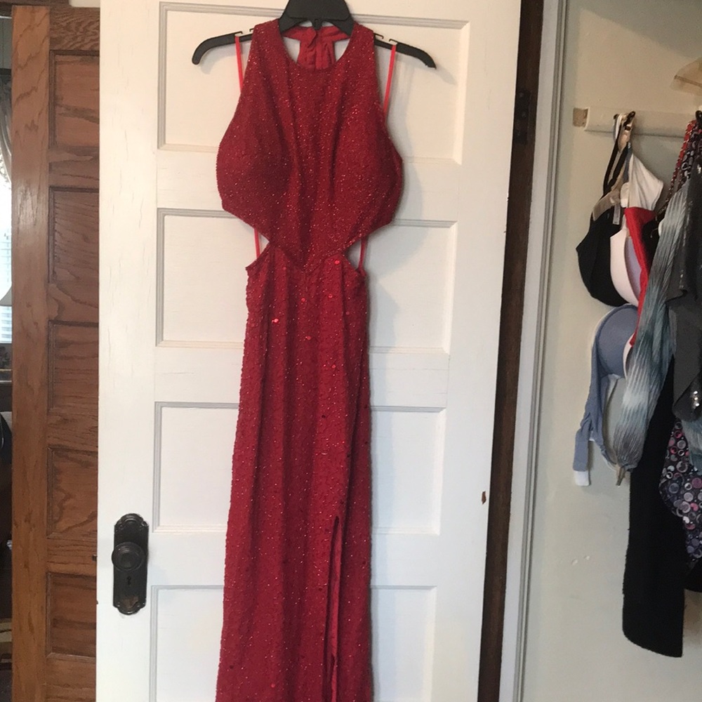 A red fully beaded prom Gown